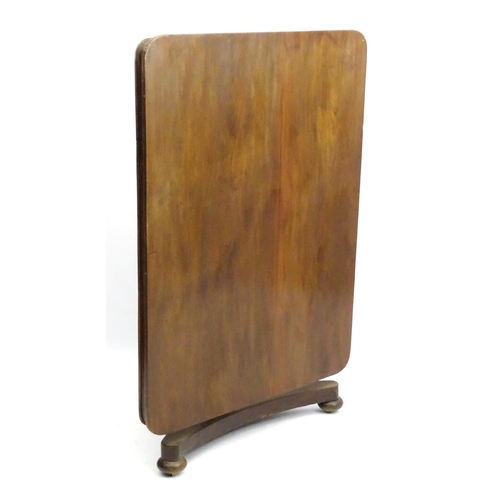 293 - A mid 19thC mahogany tilt top breakfast table, with large rectangular top above a turned column and ... 