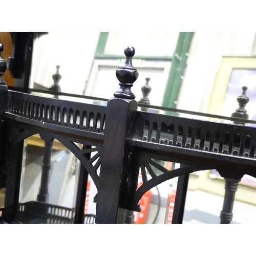 298 - An aesthetic movement mirror with shelves