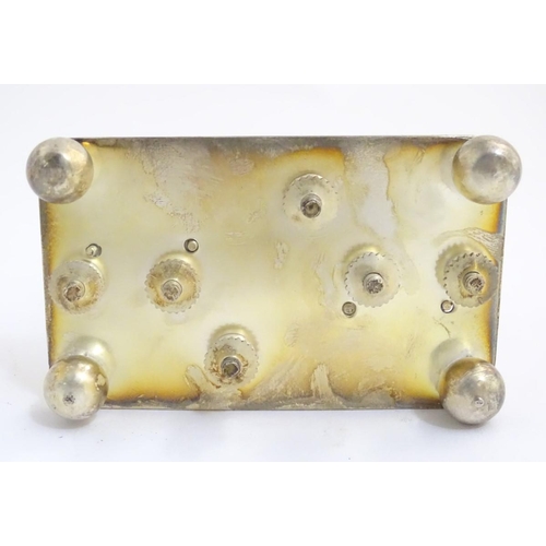 357 - A 21stC silver plated toast rack, the divisions formed as the letters 'TOAST'. 4 1/4'' long, 5'' tal... 