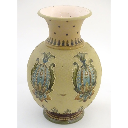 32 - A Mettlach vase with a flared rim and bulbous body, decorated with sylised floral and foliate motifs... 