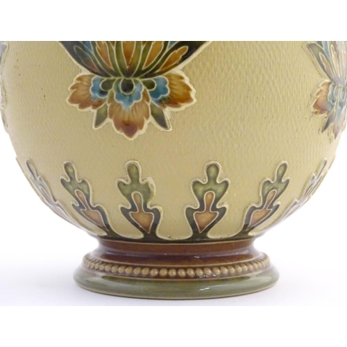 32 - A Mettlach vase with a flared rim and bulbous body, decorated with sylised floral and foliate motifs... 