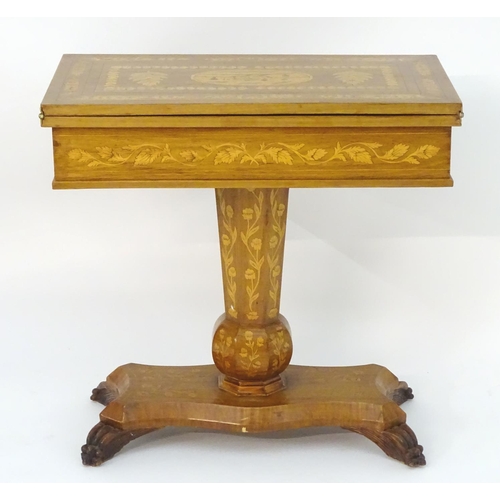 1021 - A 19thC and later Irish Killarney style games table with a marquetry inlaid and decoratively strung ... 
