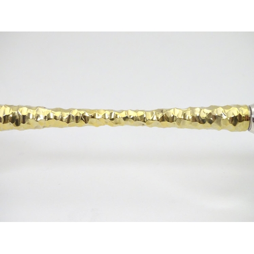 227 - An Elizabeth II silver gilt Stuart Devlin champagne flute having flaring conical body with textured ... 