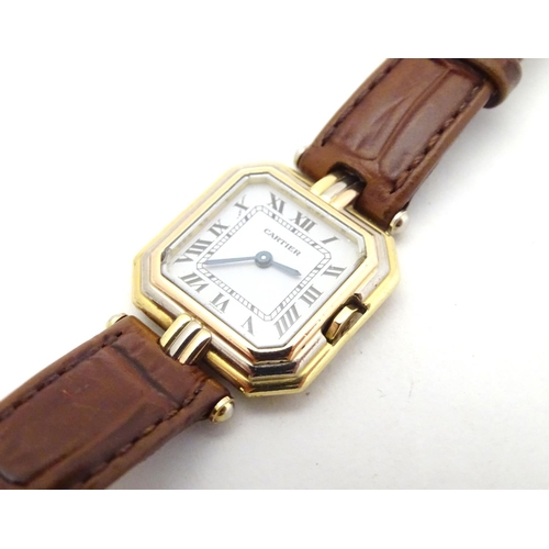 510 - Cartier Paris: a ladies' Ceinture 18ct gold cased wristwatch, of octagonal form with stepped edges, ... 