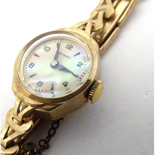 510A - A Rotary 9ct gold cased ladies' wristwatch, fitted with a 9ct gold strap. With Rotary watch case.