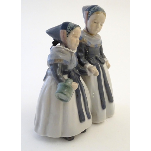 65 - A Royal Copenhagen figure of two Amager girls in traditional dress, model no. 1316, designed by Lott... 