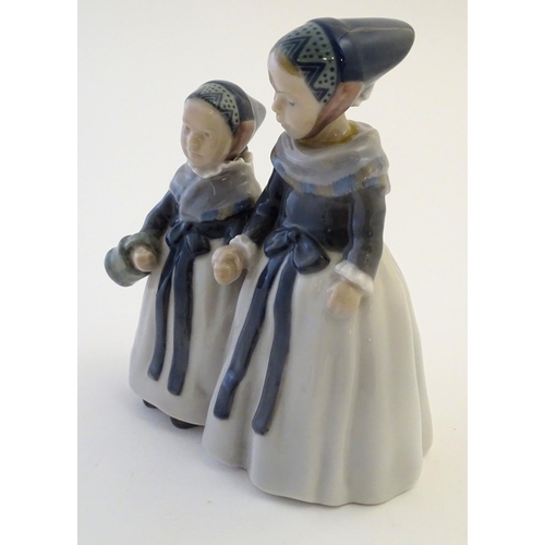 65 - A Royal Copenhagen figure of two Amager girls in traditional dress, model no. 1316, designed by Lott... 