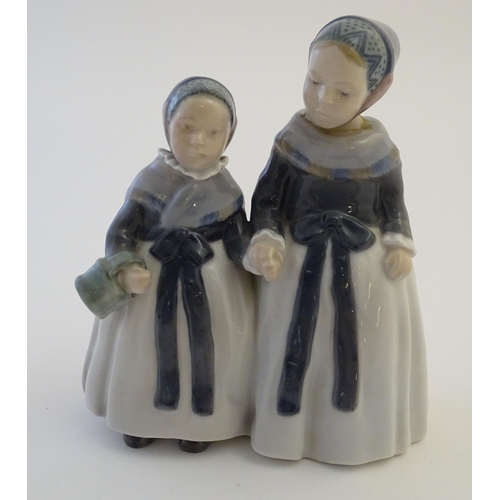 65 - A Royal Copenhagen figure of two Amager girls in traditional dress, model no. 1316, designed by Lott... 