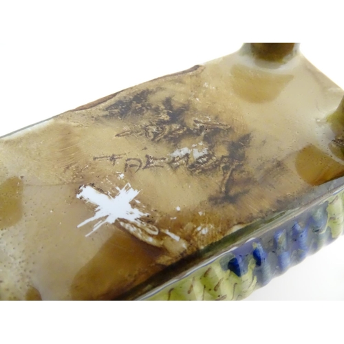 72 - A Continental faience inkwell of sarcophagus form  on four paw feet with hand painted floral decorat... 