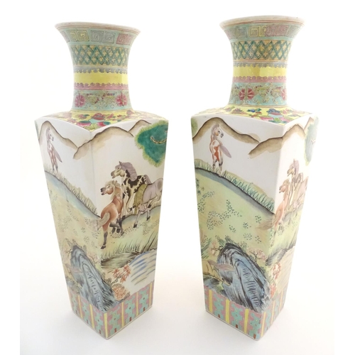 116 - A pair of Chinese square sectional vases with flared rims, decorated with horses in a landscape scen... 