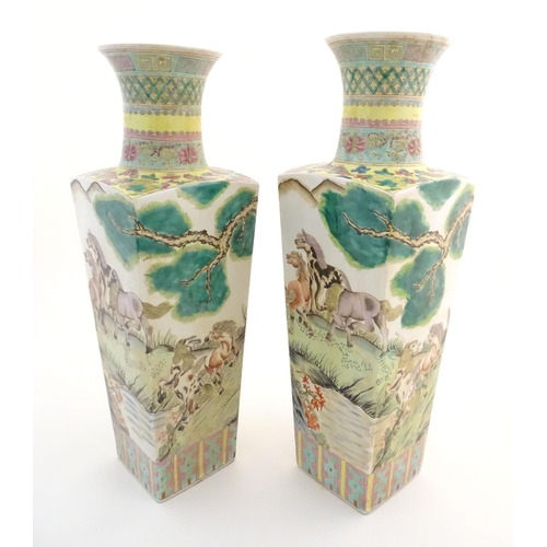 116 - A pair of Chinese square sectional vases with flared rims, decorated with horses in a landscape scen... 