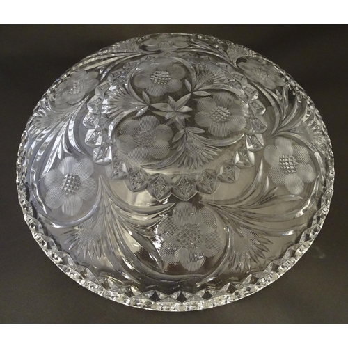 162 - A large early 20thC cut glass charger, decorated with thistle, frond, star and rose cuts and diamond... 