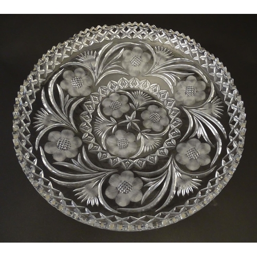 162 - A large early 20thC cut glass charger, decorated with thistle, frond, star and rose cuts and diamond... 