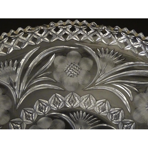 162 - A large early 20thC cut glass charger, decorated with thistle, frond, star and rose cuts and diamond... 