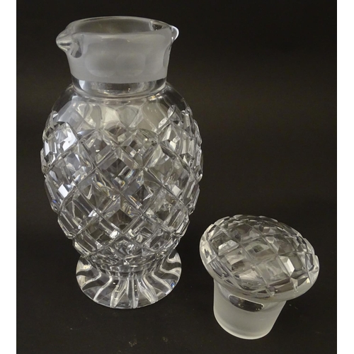 170 - Glass: a 20thC cut crystal decanter, decorated with star, hobnail and block cuts, the next with dual... 