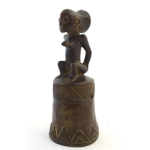 540 - Ethnographic / Native / Tribal: A carved African wooden bell / vessel with geometric detail surmount... 