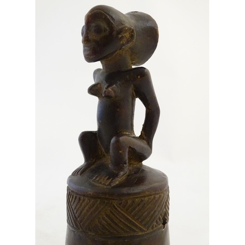 540 - Ethnographic / Native / Tribal: A carved African wooden bell / vessel with geometric detail surmount... 