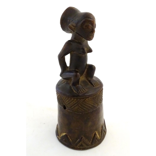 540 - Ethnographic / Native / Tribal: A carved African wooden bell / vessel with geometric detail surmount... 
