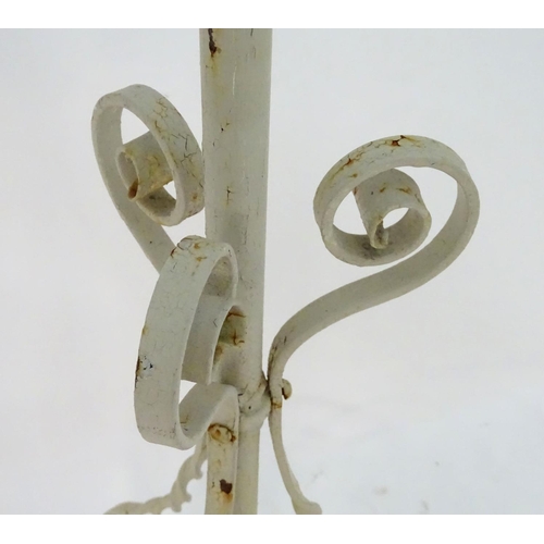 572 - Lighting: a late-Victorian wrought iron and copper lamp stand, with white painted finish, supported ... 