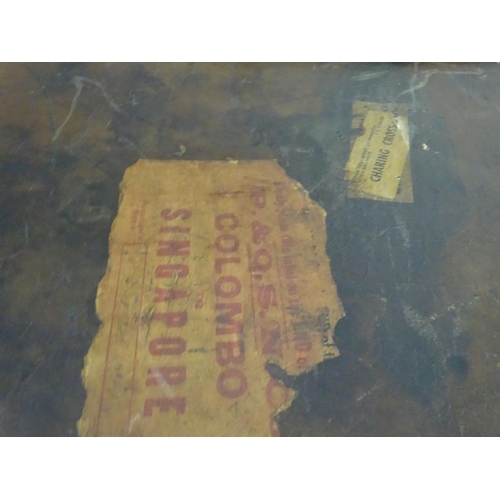 856 - A late 19thC leather travelling trunk flanked by carrying handles. 34