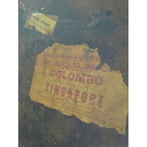 856 - A late 19thC leather travelling trunk flanked by carrying handles. 34