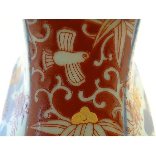 107 - A Victoria Ware ironstone octagonal jug decorated in the Imari palette with floral and bird decorati... 