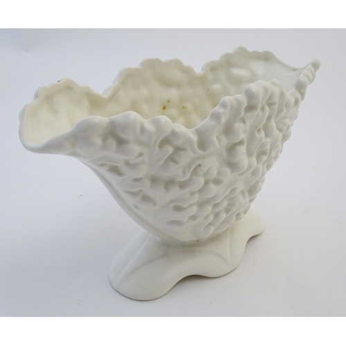 110 - A Sylvac posy holder / vase, the body moulded with a leaf pattern in a white glaze. Approx. 6 1/4