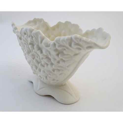 110 - A Sylvac posy holder / vase, the body moulded with a leaf pattern in a white glaze. Approx. 6 1/4