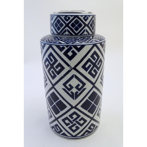 111 - A late 20th / early 21stC blue and white cylindrical jar and cover with geometric decoration. Approx... 