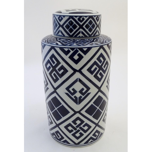 111 - A late 20th / early 21stC blue and white cylindrical jar and cover with geometric decoration. Approx... 