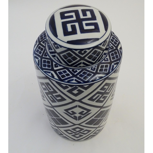 111 - A late 20th / early 21stC blue and white cylindrical jar and cover with geometric decoration. Approx... 