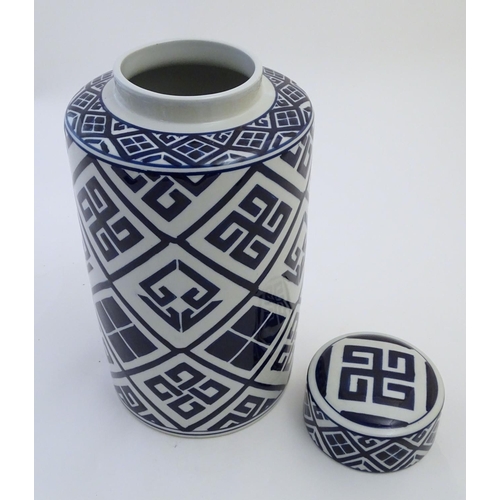 111 - A late 20th / early 21stC blue and white cylindrical jar and cover with geometric decoration. Approx... 