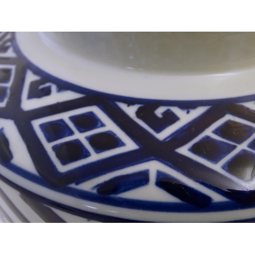 111 - A late 20th / early 21stC blue and white cylindrical jar and cover with geometric decoration. Approx... 