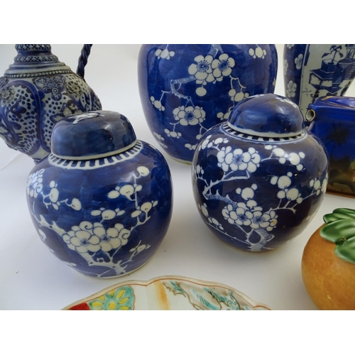 112 - A quantity of assorted ceramics to include a Chinese blue and white lidded vase with cherry blossom ... 