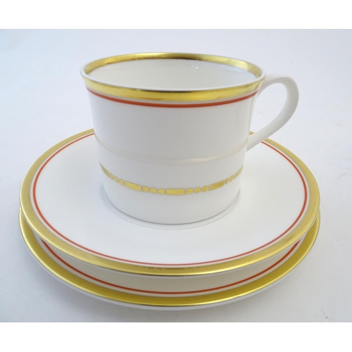 125 - A quantity of Royal Worcester tea wares with decorative gilt and red banding. Comprising 6 teacups, ... 