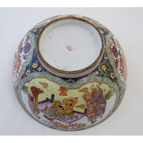 126 - A large Japanese bowl with hand painted decoration the central roundel depicting figures / geisha gi... 