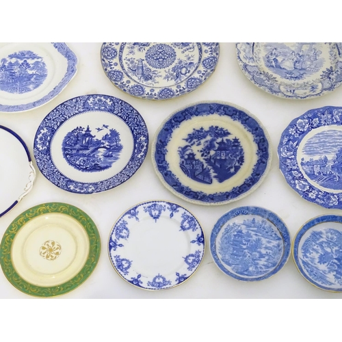 129 - A large quantity of assorted blue and white ceramic wares, to include jugs, plates, vases, butter / ... 