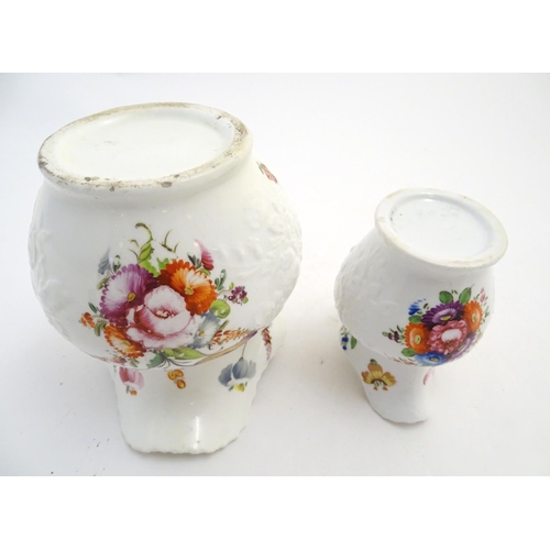 133 - Two 19thC jugs with relief floral decoration and hand painted flowers. Tallest approx. 6 3/4