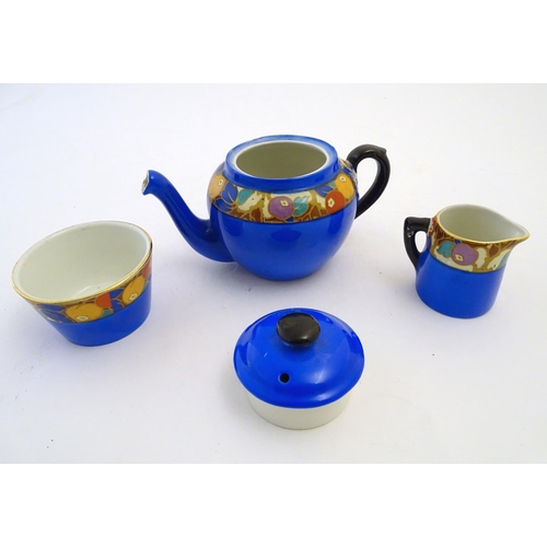 138 - Empire ware tea wares comprising, teapot, sugar bowl and milk jug decorated in the manner of Phoenix... 