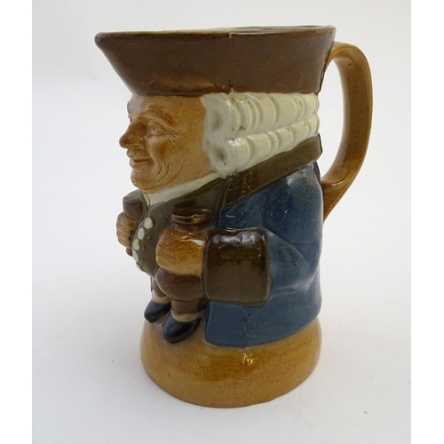 31 - A Royal Doulton Lambeth stoneware Toby character jug, The Standing Man, wearing a brown hat and wais... 