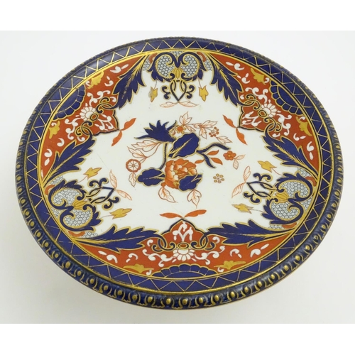 59 - An Ashworth Bros tazza in the Imari palette with floral decoration with gilt highlights. Marked unde... 