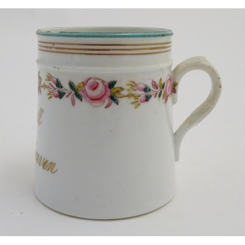 64 - A Victorian porcelain mug bearing the motto 'May we all Meet in Heaven' in gilt lettering with a flo... 