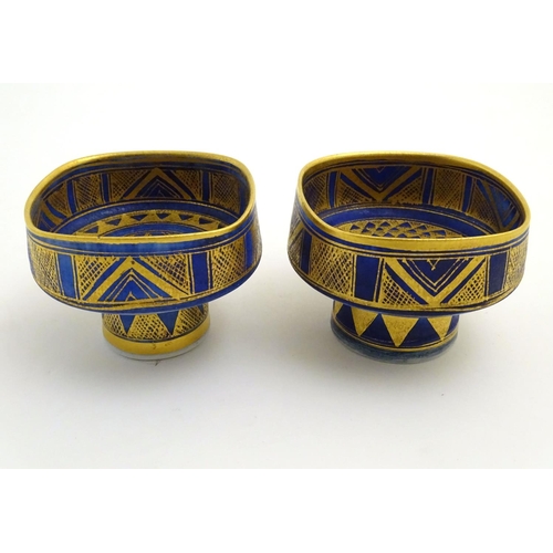 69 - A matched pair of studio pottery footed squared bowls / pots with cobalt blue and gilt geometric dec... 