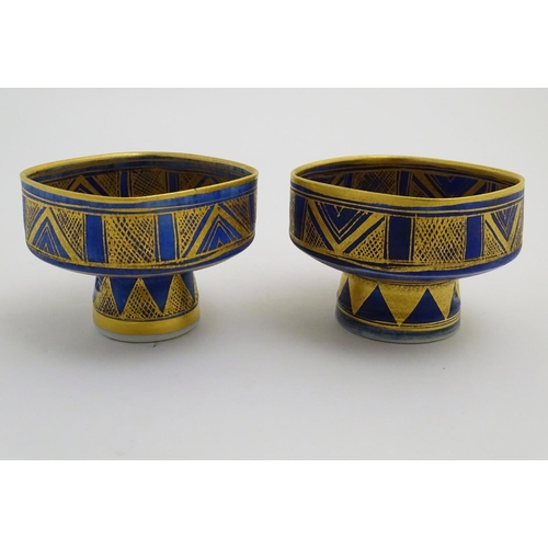 69 - A matched pair of studio pottery footed squared bowls / pots with cobalt blue and gilt geometric dec... 