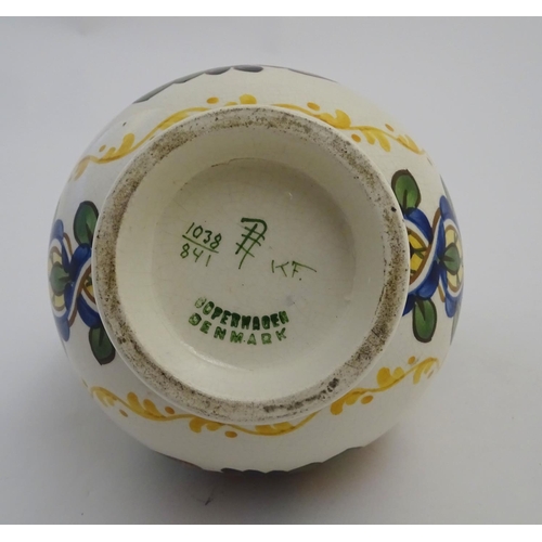 71 - An Alumina faience globular vase with a squared rim and floral decoration. Marked under with Copenha... 