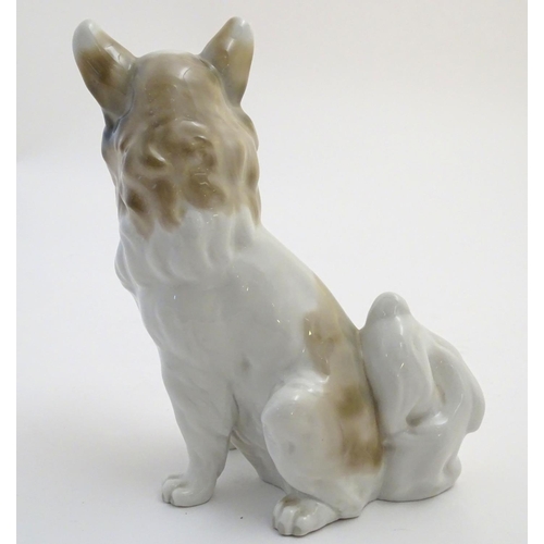 74 - A Nao figurine modelled as a seated long haired chihuahua / papillon dog. Impressed NAO mark to base... 