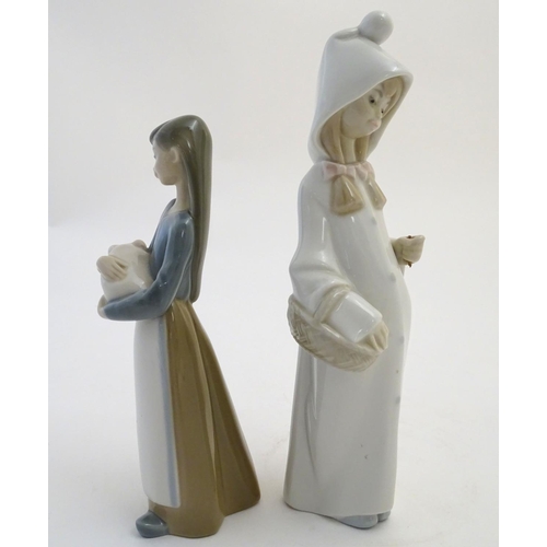 76 - Two Lladro figures to include a girl holding a piglet Girl with Pig, model no. 1011, and Girl with B... 