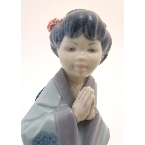 77 - Three Lladro figures modelled as Japanese geisha girls, Oriental Spring, a girl holding a parasol, m... 