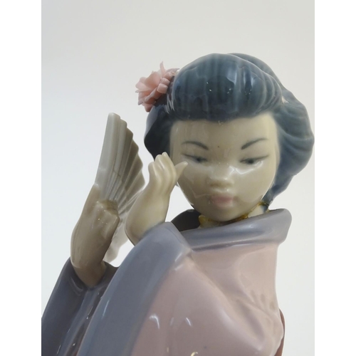 77 - Three Lladro figures modelled as Japanese geisha girls, Oriental Spring, a girl holding a parasol, m... 