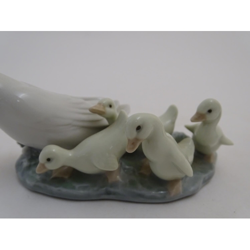 88 - Two Lladro figures models as geese, a Mother Goose and her Goslings figure group, model no. 1307, an... 